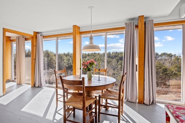 dining room with concrete flooring