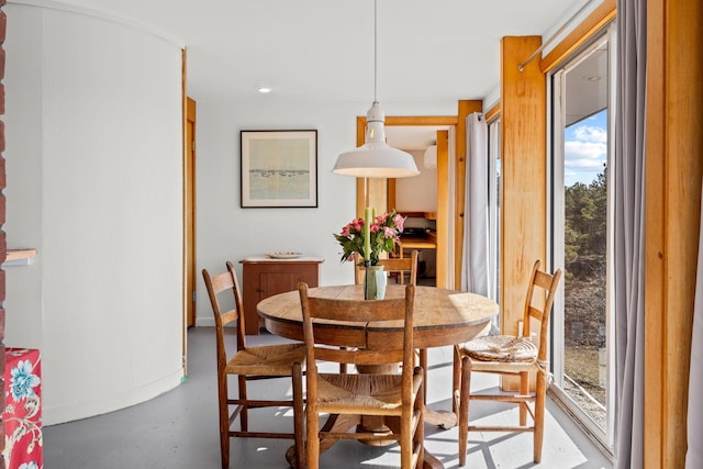 dining room featuring concrete flooring