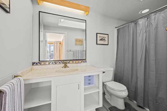 bathroom with vanity and toilet