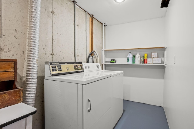 washroom with washing machine and dryer