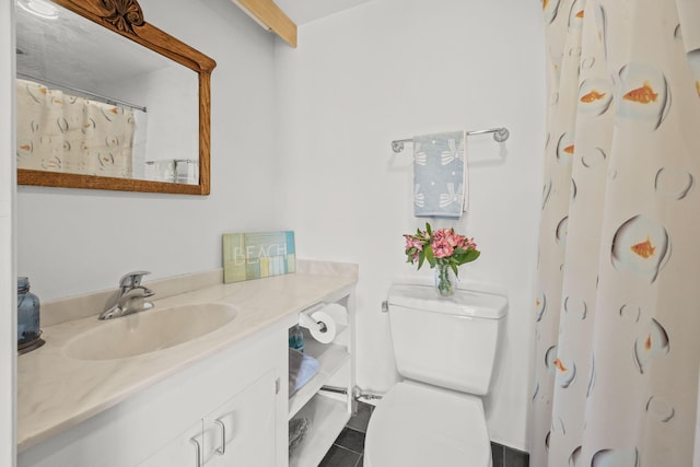 bathroom with vanity, a shower with curtain, tile patterned floors, and toilet