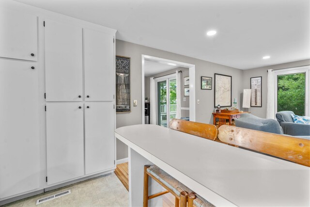 12 Running Light Way, Mashpee, MA 02649 - kitchen with healthy amount of natural light, white cabinetry, recessed lighting, light countertops, and baseboards