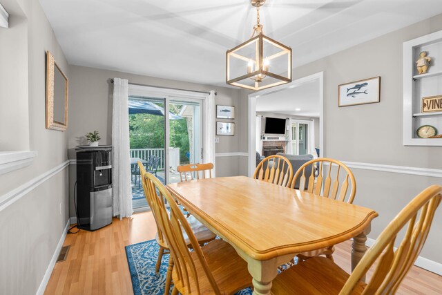 12 Running Light Way, Mashpee, MA 02649 - dining space with light wood-style flooring, baseboards, and a chandelier