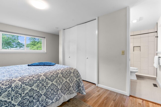 12 Running Light Way, Mashpee, MA 02649 - bedroom featuring light wood-style flooring, a closet, baseboards, and ensuite bathroom