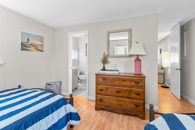 12 Running Light Way, Mashpee, MA 02649 - bedroom featuring light wood-type flooring, baseboards, and ensuite bathroom