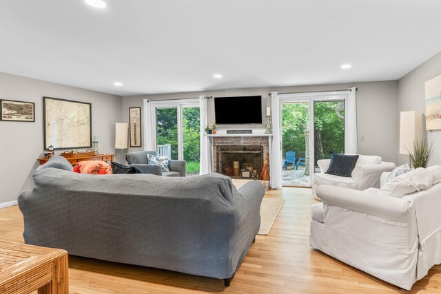 12 Running Light Way, Mashpee, MA 02649 - living room featuring healthy amount of natural light, recessed lighting, a fireplace with raised hearth, and light wood-type flooring