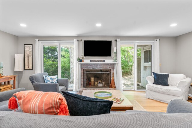 12 Running Light Way, Mashpee, MA 02649 - living area with wood finished floors, healthy amount of natural light, a brick fireplace, and recessed lighting