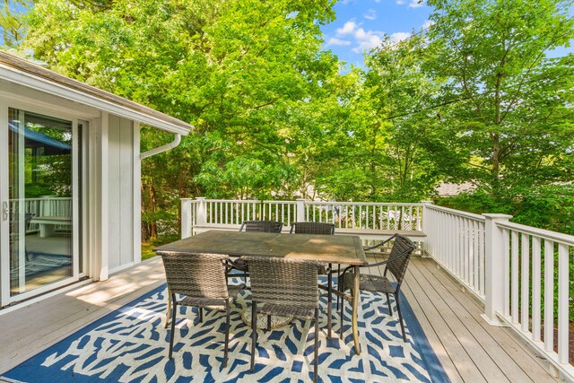 12 Running Light Way, Mashpee, MA 02649 - wooden terrace with outdoor dining area and view of scattered trees