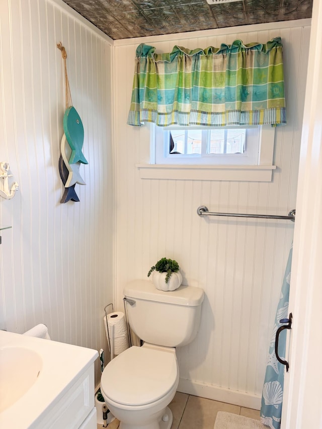 bathroom with tile patterned floors, vanity, and toilet