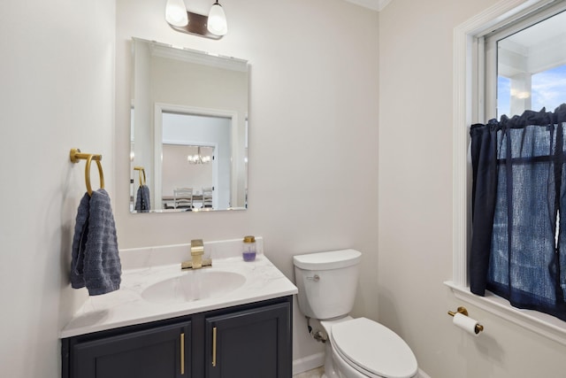 4 Charles Ln, Falmouth, MA 02540 - bathroom with toilet, vanity, baseboards, and a chandelier