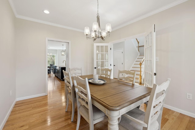4 Charles Ln, Falmouth, MA 02540 - dining space featuring a chandelier, crown molding, stairs, light wood-style flooring, and baseboards