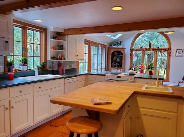 kitchen featuring white cabinetry, sink, white appliances, and light wood-type flooring