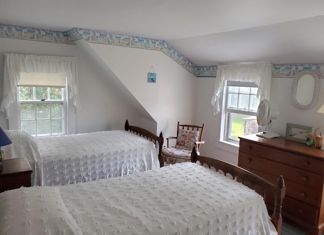 bedroom featuring lofted ceiling