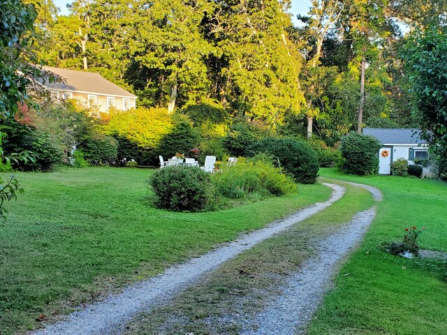 view of property's community with a lawn