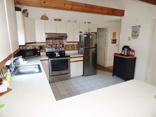 kitchen featuring sink, white cabinetry, stainless steel appliances, tasteful backsplash, and light tile patterned flooring