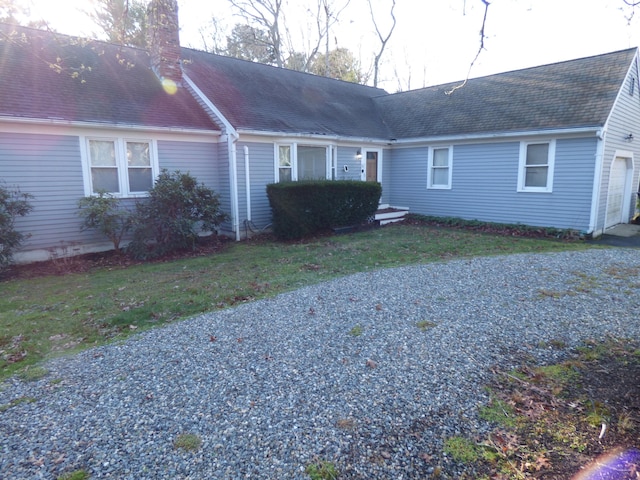 view of front of home featuring a garage and a front lawn