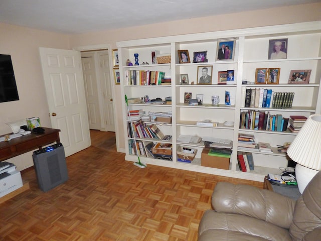 sitting room with parquet flooring