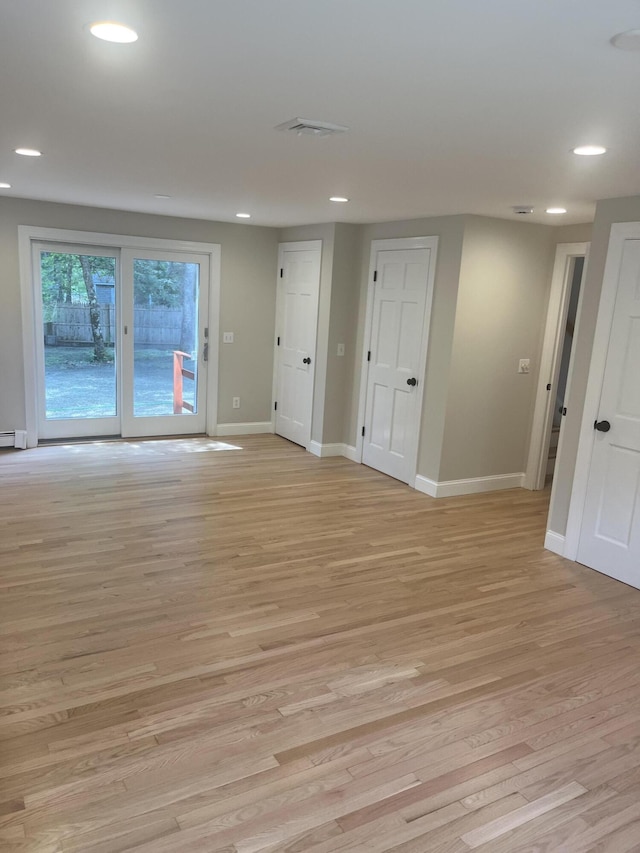 spare room featuring light wood-type flooring