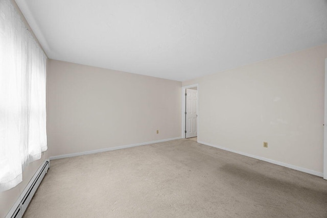 2 Englewood Dr Unit H-1, Harwich, MA 02645 - spare room with a baseboard heating unit, plenty of natural light, and light colored carpet