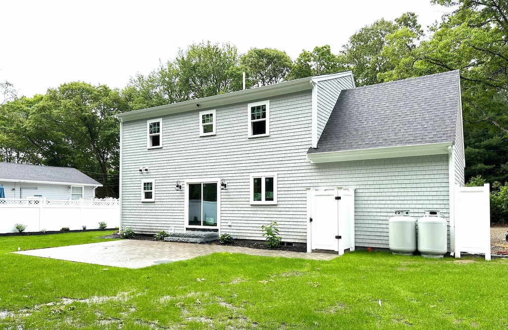 48 Round Pond Dr, Hatchville, MA 02536 - back of house with a patio area, a shingled roof, and view of scattered trees