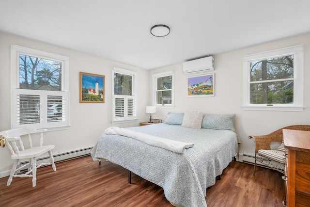 bedroom featuring a wall mounted air conditioner, wood finished floors, and multiple windows