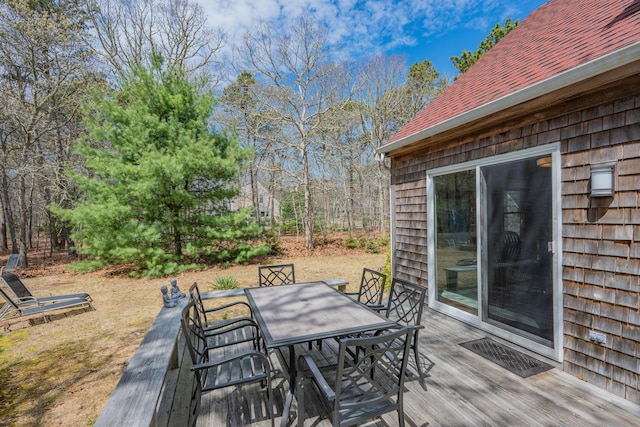 deck with outdoor dining area