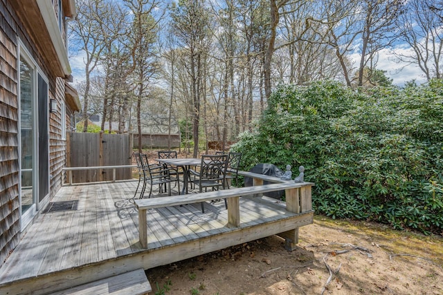 view of patio with a wooden deck and outdoor dining space