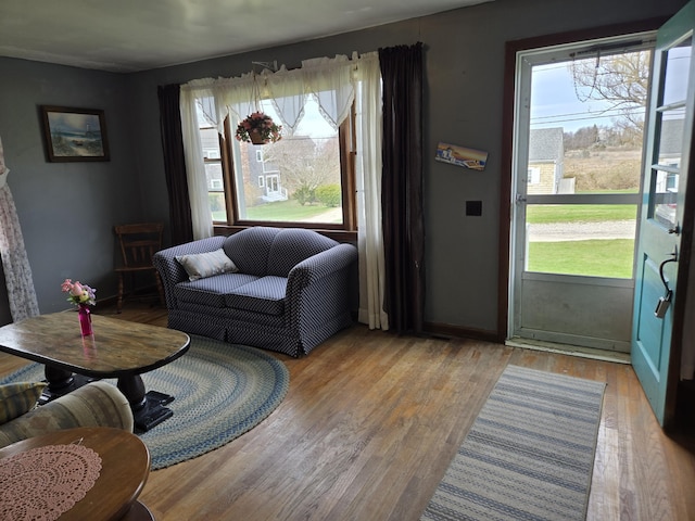 57 Cedar Hill Rd, Brewster, MA 02631 - living area featuring healthy amount of natural light, wood finished floors, and baseboards