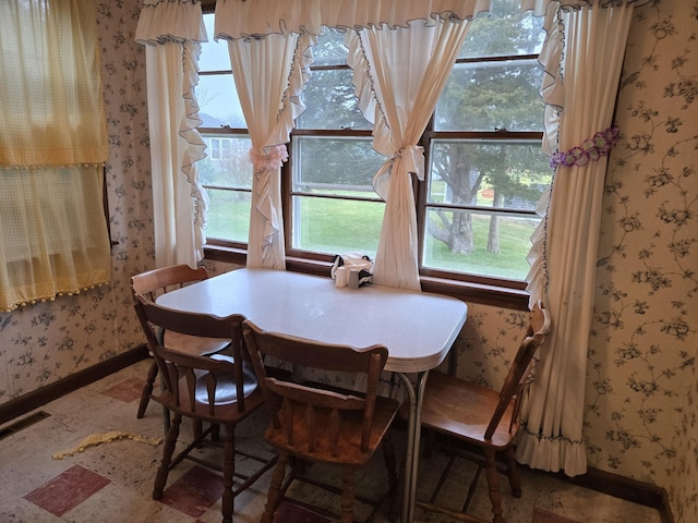 57 Cedar Hill Rd, Brewster, MA 02631 - dining space with wallpapered walls and baseboards