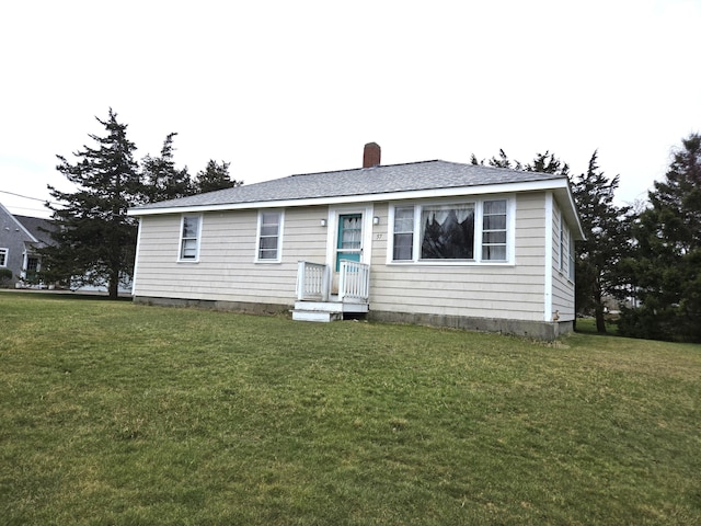 57 Cedar Hill Rd, Brewster, MA 02631 - view of front facade with a chimney, a front lawn, and a shingled roof