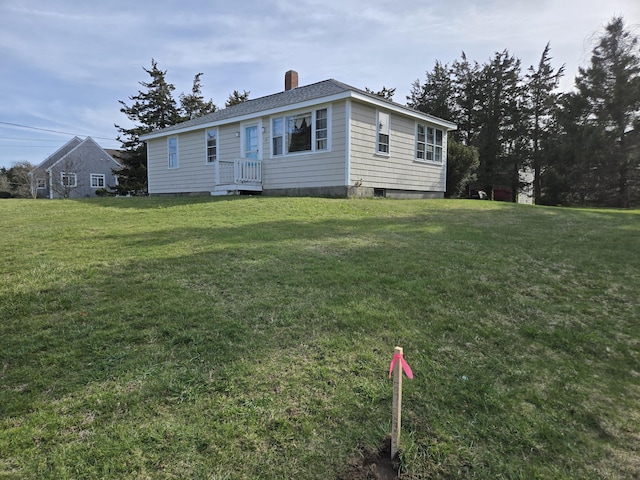 57 Cedar Hill Rd, Brewster, MA 02631 - view of front of home with a front yard and a chimney