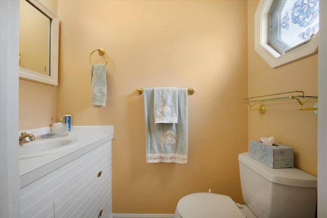 bathroom featuring toilet and vanity