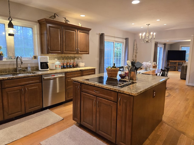 13 Quail Hollow Cir, Sandwich, MA 02563 - kitchen with stainless steel dishwasher, black electric stovetop, a sink, a chandelier, and recessed lighting