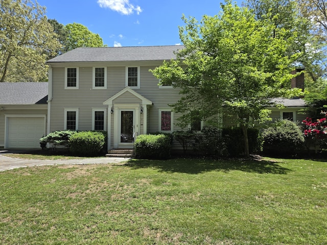 13 Quail Hollow Cir, Sandwich, MA 02563 - colonial house featuring a garage, a front lawn, a shingled roof, and driveway