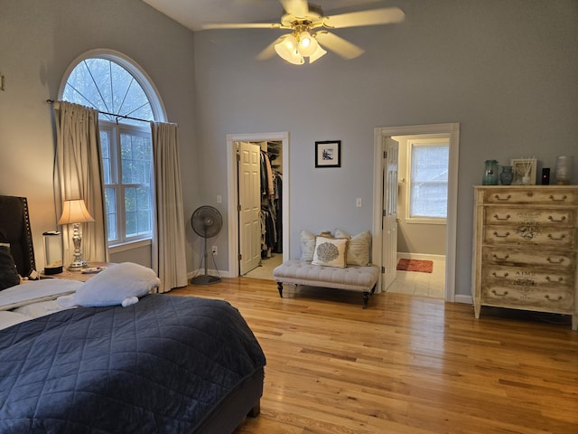 13 Quail Hollow Cir, Sandwich, MA 02563 - bedroom featuring wood finished floors, multiple windows, high vaulted ceiling, a spacious closet, and ceiling fan