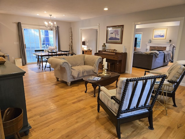 13 Quail Hollow Cir, Sandwich, MA 02563 - living area with a chandelier, recessed lighting, light wood-style flooring, and a fireplace