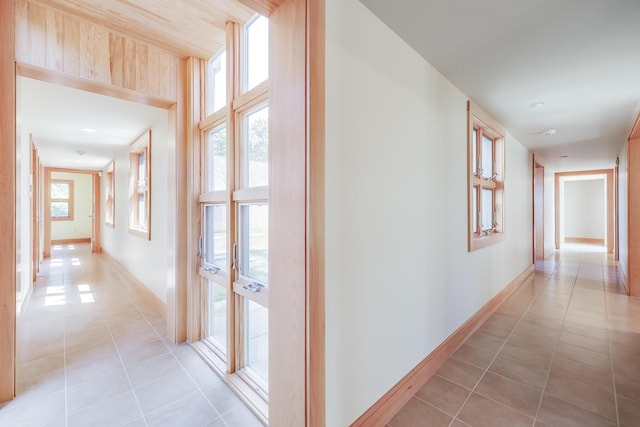 hallway featuring light tile patterned floors