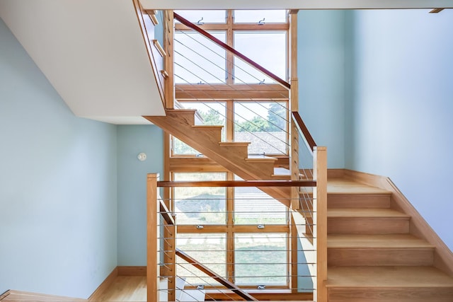 stairs featuring wood-type flooring