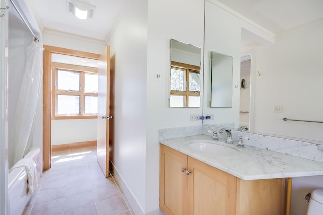 bathroom with shower / bath combo with shower curtain, vanity, ornamental molding, and tile patterned flooring