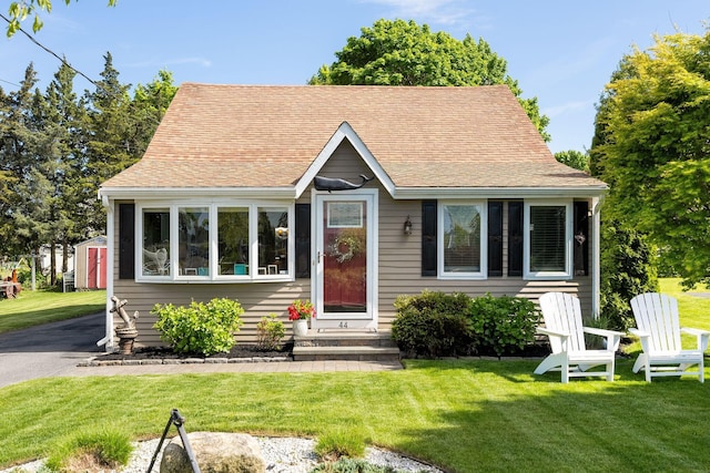 44 Buttermilk Way, Buzzards Bay, MA 02532 - view of front facade with a front yard, entry steps, and a shingled roof