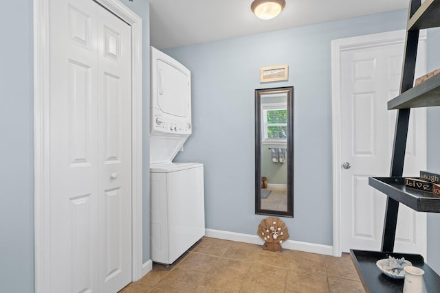 44 Buttermilk Way, Buzzards Bay, MA 02532 - washroom with stacked washer / dryer, baseboards, and light tile patterned floors