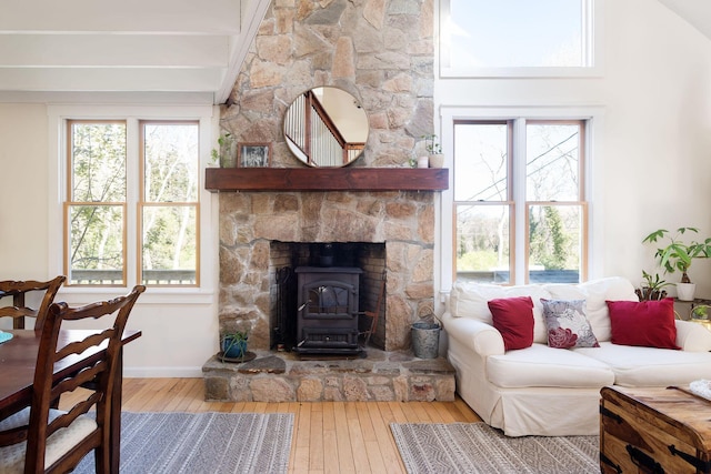 532 S Orleans Rd, Orleans, MA 02653 - living room featuring a wood stove, wood-type flooring, and plenty of natural light