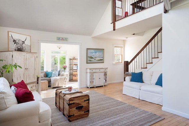 532 S Orleans Rd, Orleans, MA 02653 - living room with light wood-type flooring, stairs, high vaulted ceiling, and healthy amount of natural light