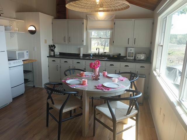 100 Hiawatha Rd Unit B, Wellfleet, MA 02667 - kitchen featuring a sink, white appliances, dark countertops, dark wood-style floors, and lofted ceiling