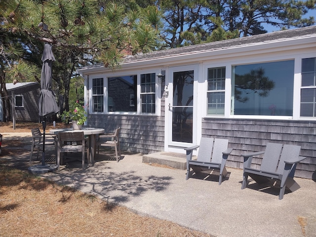 100 Hiawatha Rd Unit B, Wellfleet, MA 02667 - view of front of home with a patio and outdoor dining area