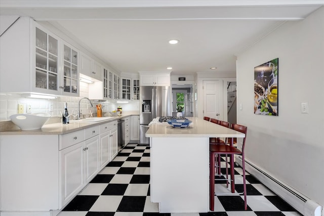 117 Parker Rd, Osterville, MA 02655 - kitchen featuring tile patterned floors, a sink, a baseboard heating unit, stainless steel appliances, and recessed lighting
