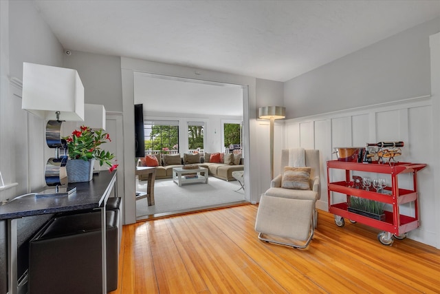 117 Parker Rd, Osterville, MA 02655 - sitting room featuring a decorative wall, wood finished floors, and wainscoting