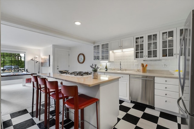 117 Parker Rd, Osterville, MA 02655 - kitchen with appliances with stainless steel finishes, light flooring, a sink, light countertops, and recessed lighting