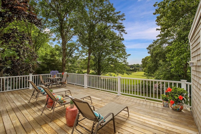 117 Parker Rd, Osterville, MA 02655 - wooden deck with outdoor dining space and view of scattered trees