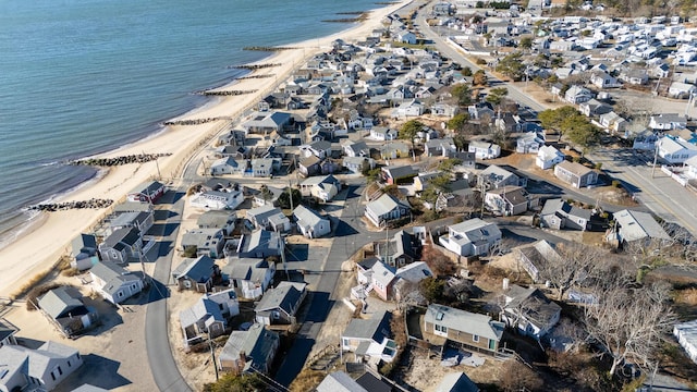 bird's eye view with a water view and a beach view